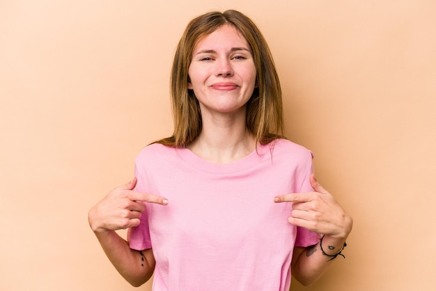 Person pointing by hand to a shirt copy space proud and confident