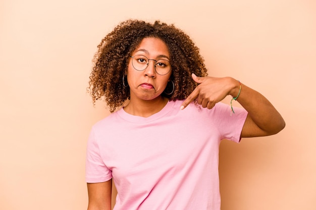 Person pointing by hand to a shirt copy space proud and confident