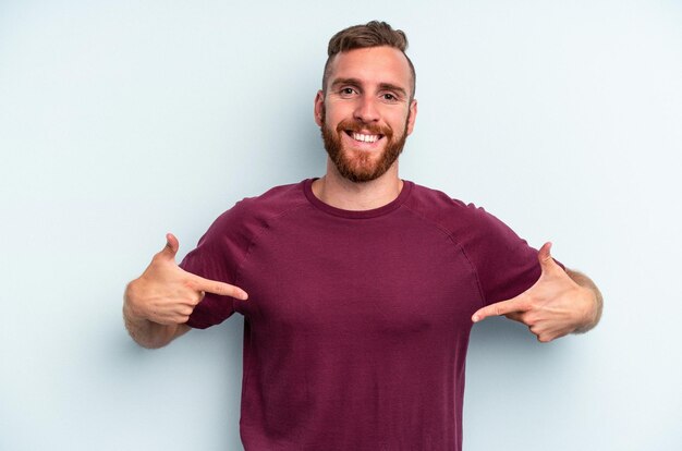 Person pointing by hand to a shirt copy space proud and confident