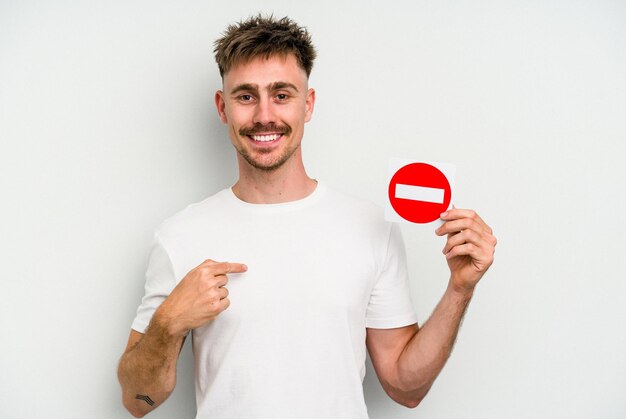 Person pointing by hand to a shirt copy space proud and confident