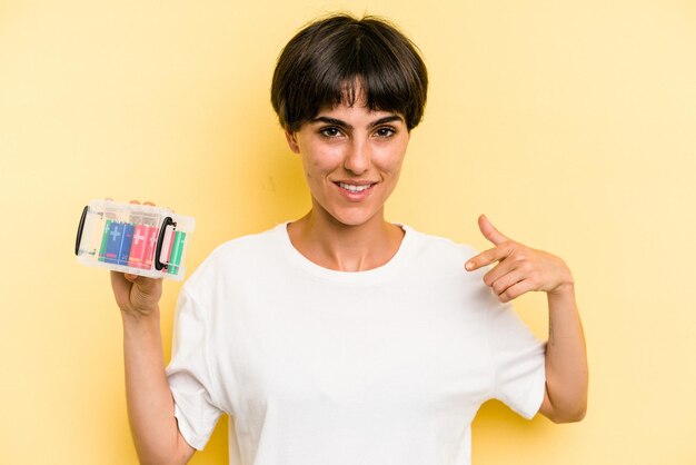 Person pointing by hand to a shirt copy space proud and confident