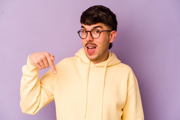 Person pointing by hand to a shirt copy space proud and confident