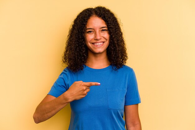 Person pointing by hand to a shirt copy space proud and confident