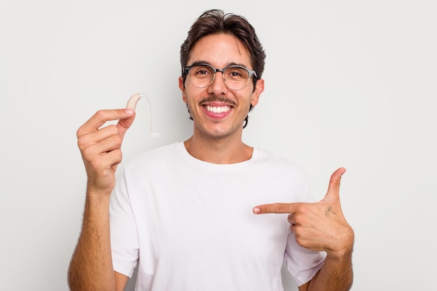 Person pointing by hand to a shirt copy space proud and confident