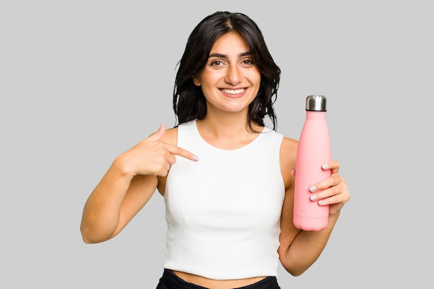 Person pointing by hand to a shirt copy space proud and confident