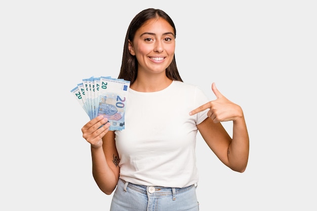 Person pointing by hand to a shirt copy space proud and confident