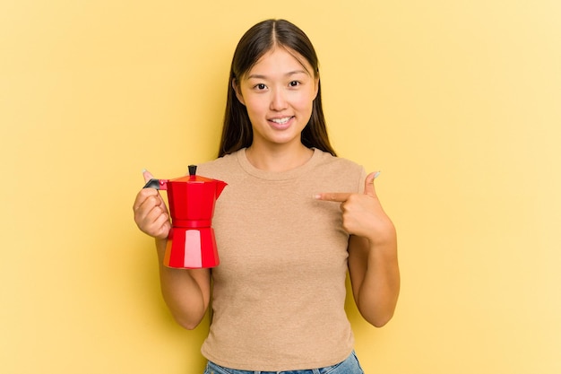 Person pointing by hand to a shirt copy space proud and confident