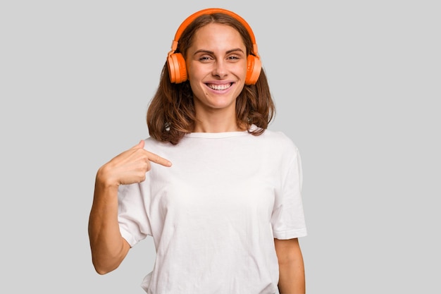 Person pointing by hand to a shirt copy space proud and confident