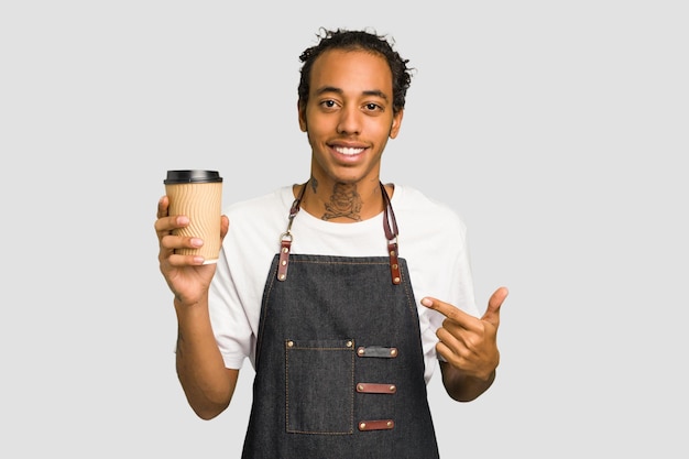 Person pointing by hand to a shirt copy space proud and confident