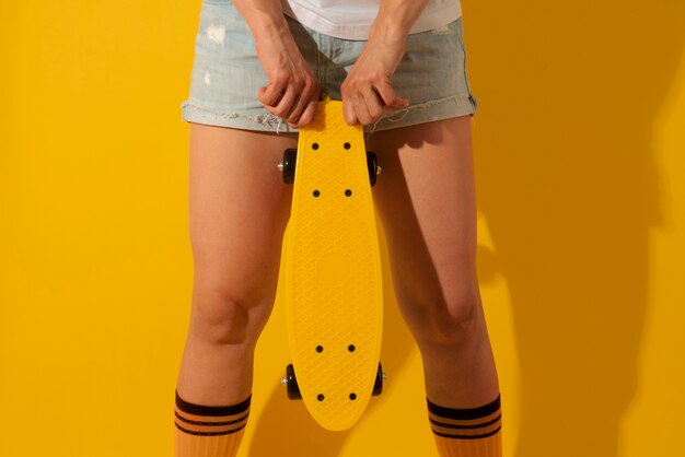 Person posing with skateboard