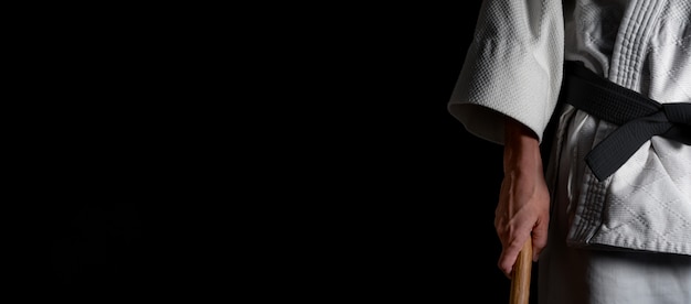 Photo person practicing aikido on a black background.