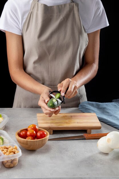 Person practicing batch cooking with healthy food