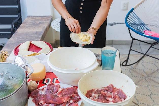 Person preparing quesadillas Preparation of typical Mexican food