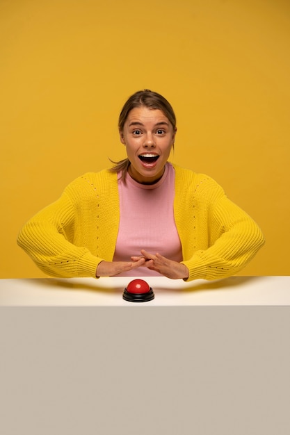 Photo person pressing a buzzer