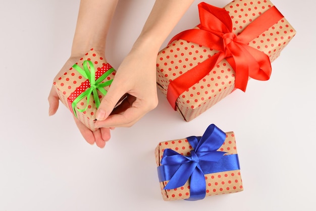 A person putting presents on a table