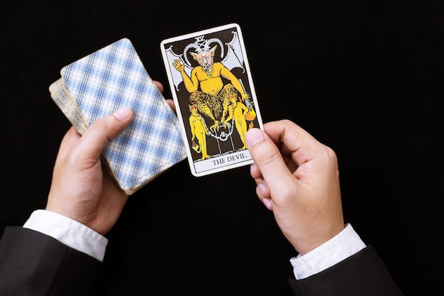 Person reading future with tarot cards