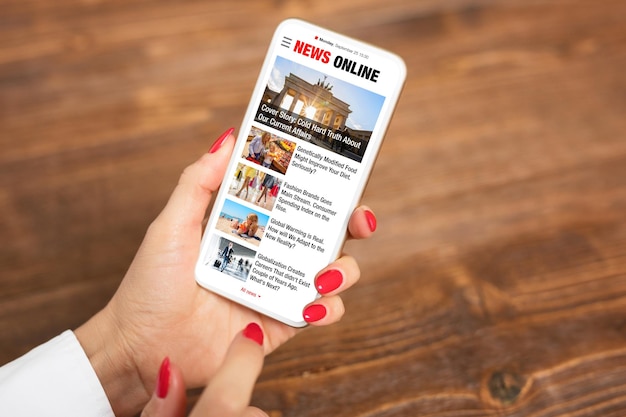 person reading news on mobile phone