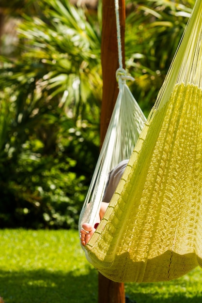 Person relaxing in hammock.