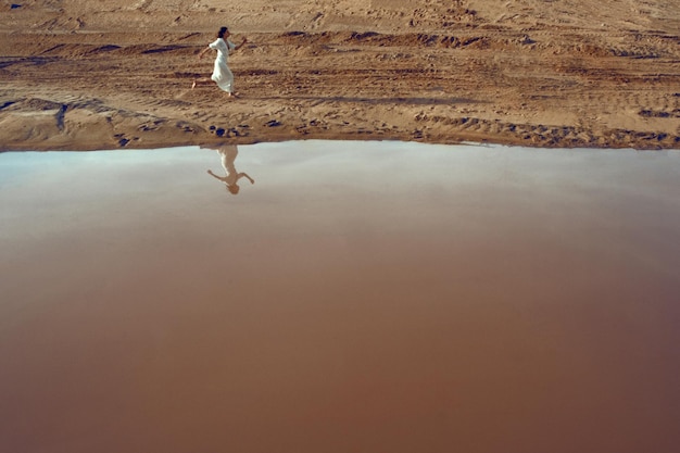 A person running along the coast