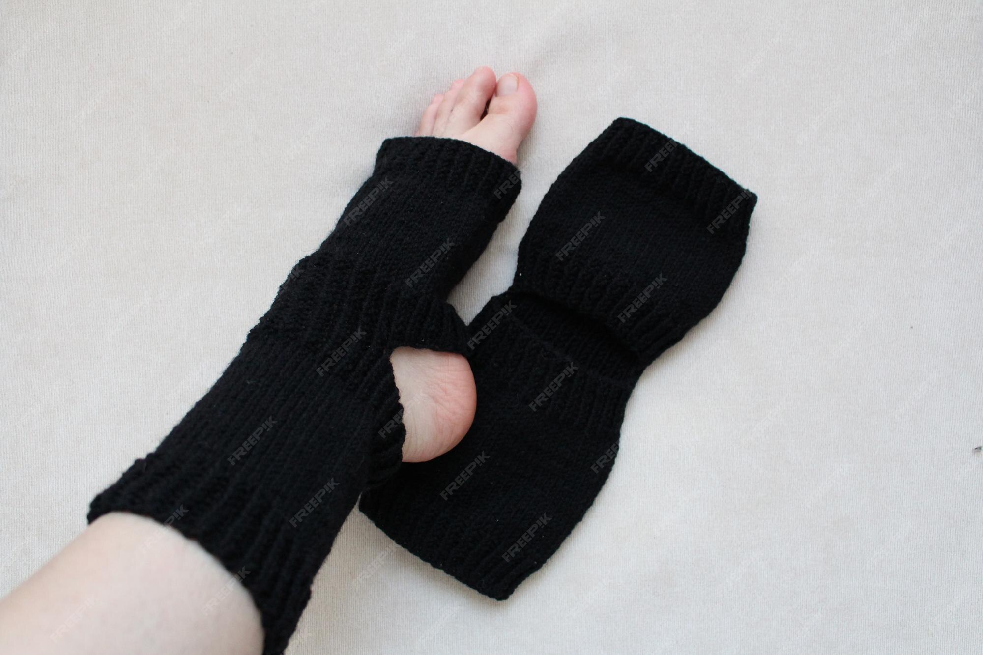 Premium Photo A person's feet wearing black socks