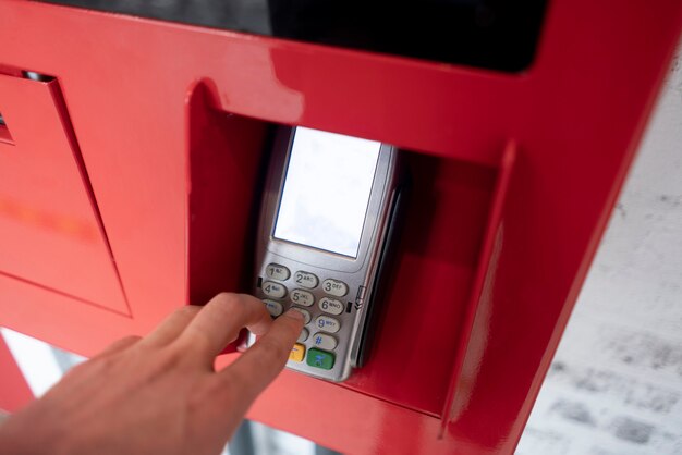 A person's hand enter password and push buttons to make a payment