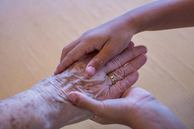 A person's hand is being examined by a person