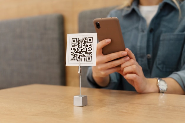 Photo person scanning qr code