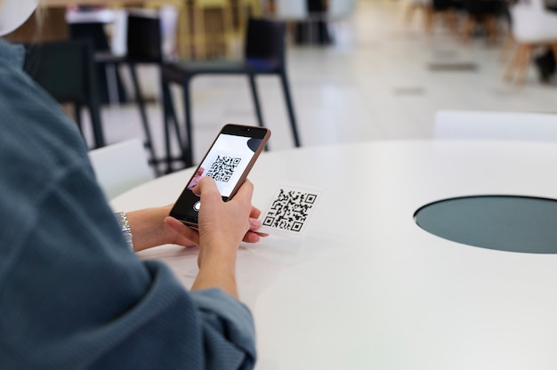 Person scanning qr code