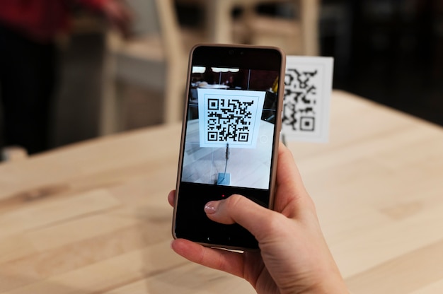 Photo person scanning qr code