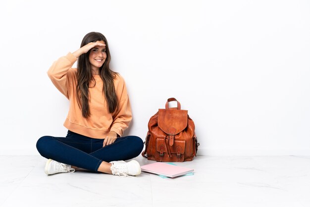 Person sitting on the floor over isolated background