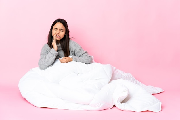 Person sitting on the floor over isolated background