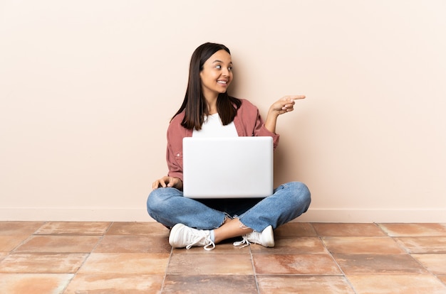 Person sitting on the floor over isolated background