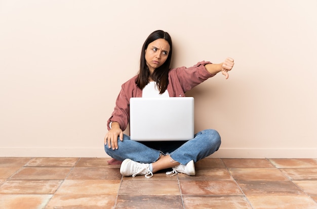 Person sitting on the floor over isolated background