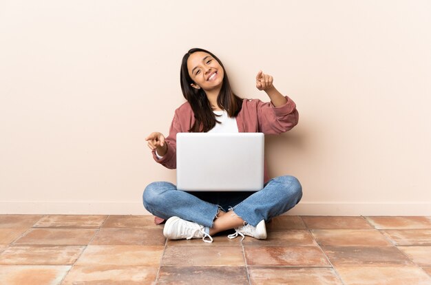 Person sitting on the floor over isolated background