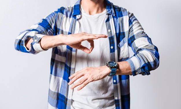 Person speaking in sign language isolated young man gesturing\
in sign language people who speak in sign language manual gestures\
of people with hearing problems