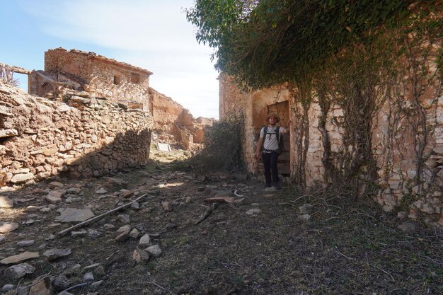 A person stands in an abandoned village in the mountains of the south of france.