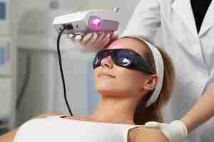 Photo person undergoing fractional laser therapy to resurface acne scars