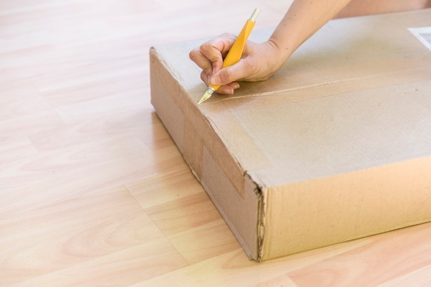 Person unpacking a box