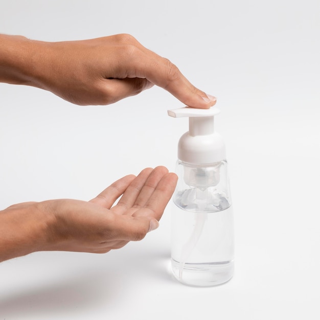 Photo person using hand sanitizer for protection