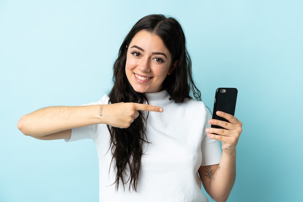 Person using mobile phone over isolated background