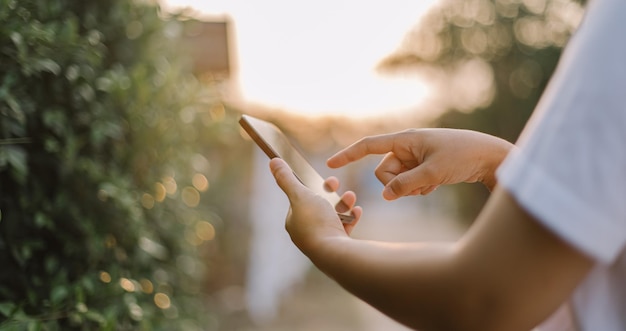 A person using a phone with the word phone on the screen