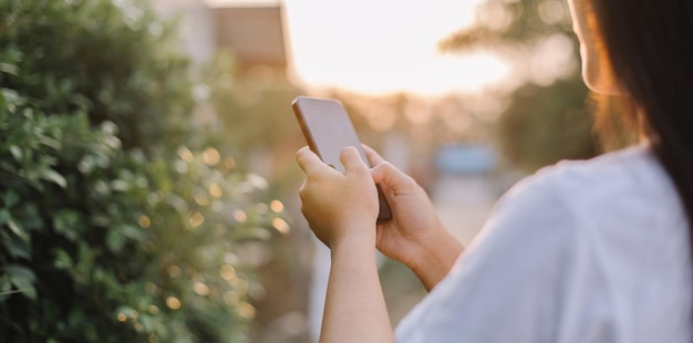 A person using a phone with the word phone on the screen