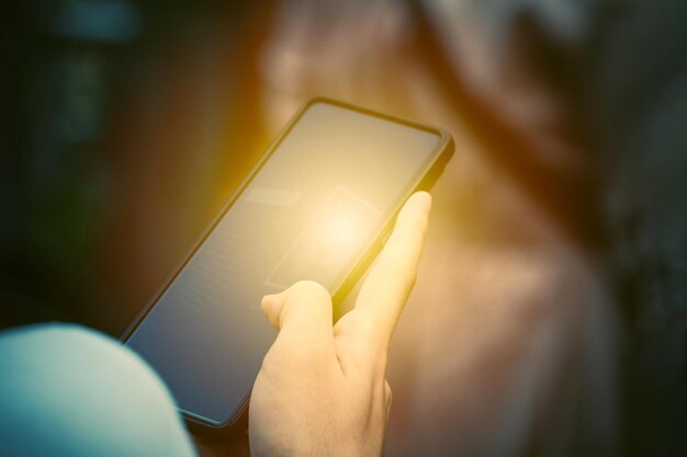 A person using a smartphone with a screen that says'app'on it