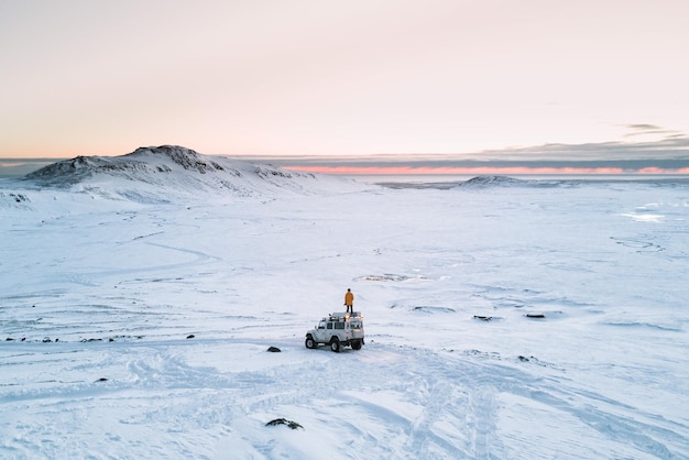 person on vehicle at snow covered landscape