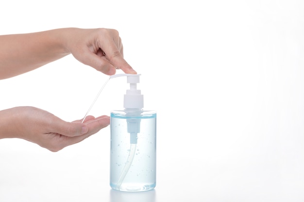 Person washing hands with alcohol gel