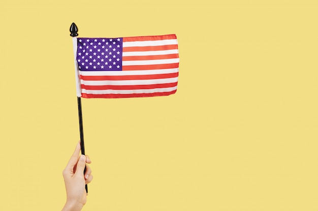 Person waving flag of United States