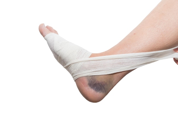 a person with a bandaged foot and a bandage on their foot