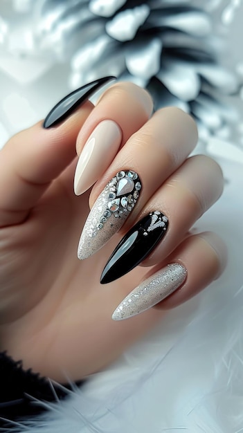 A person with a black and white manicure holding a black and white manicure