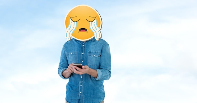 Photo person with crying emoji over face using smart phone