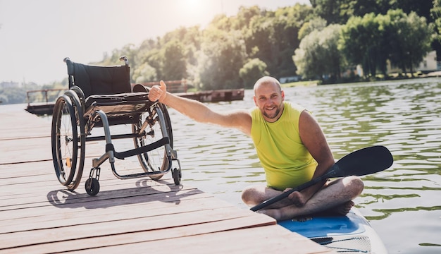 Person with a physical disability ride on sup board